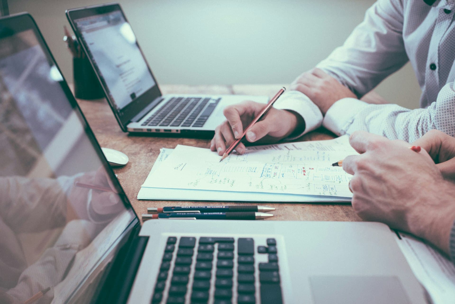 Professional workspace with financial analysis and writing